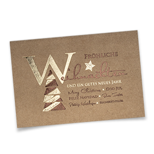 Vergrößere Abbildung Naturbraune, geschäftliche Weihnachtskarten im Querformat mit Weihnachtsbaum, Sternen und internationalen Grüßen in goldener und bronzefarbener Folienprägung.