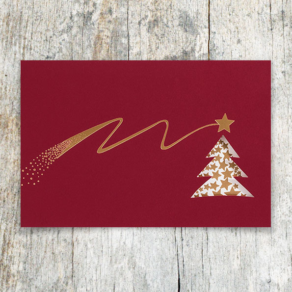 Rote Weihnachtskarten mit Sternschnuppe.
